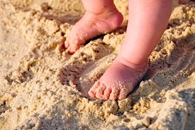 Baby feet in sand