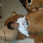 laying in a giant stuffed bear