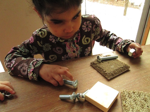 Anelia touching nuts and bolts.