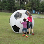 playing with a huge soccer ball