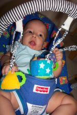 Ivan playing with hanging toys