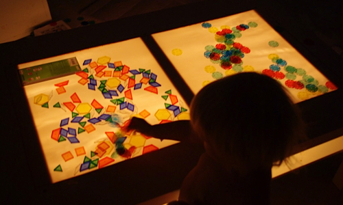 playing at a light table