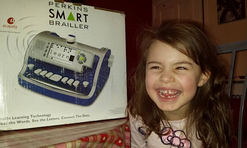 Lily Grace with the SMART Brailler box