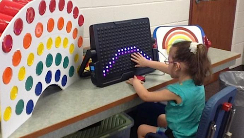 child learning about colors with the LightAide