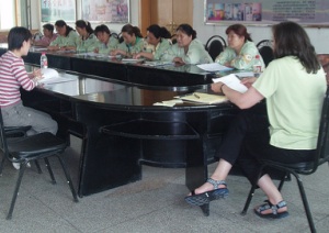 A meeting of ccupational therapists who work with children in a Chinese orphanage