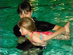 Alexis swimming at the pool