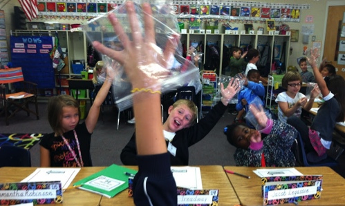 place a plastic bag over your hands to learn what it would feel like to have wings for hands