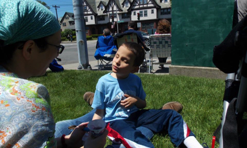 Ivan after the bouncy house eating a snow cone.
