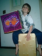 A boy playing his cajon