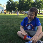 Eddie sitting in the grass