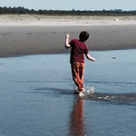 Edy playing in the ocean