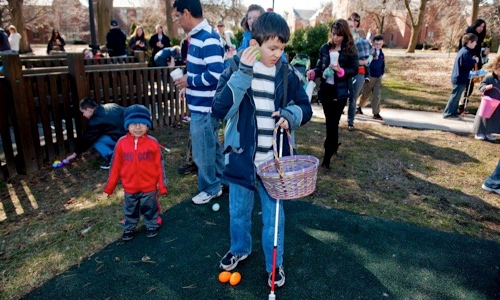 Children hunting for eggs on the Perkins campus