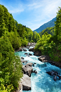 a beautiful river and green mountains