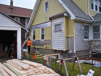 Stripping the siding off the house