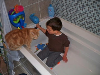 Ivan sitting in his new bathtub