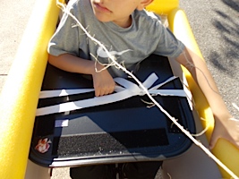 attaching the hot air balloon to Ivan's wheelchair tray