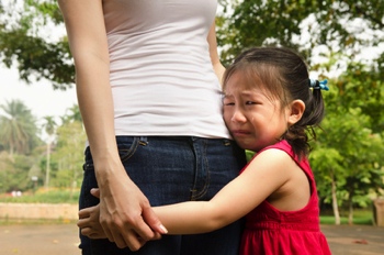 girl hugging her mom