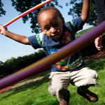 boy playing with hula hoop