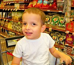 Ivan sitting in a shopping cart