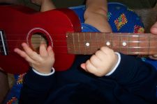 Playing ukulele.