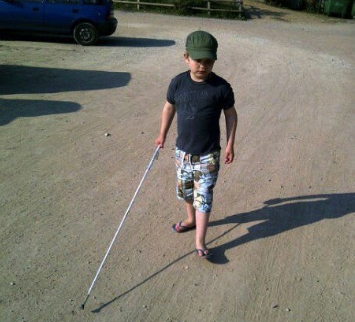 Lucas walking independently down the road