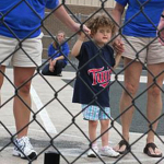 Madilyn playing baseball