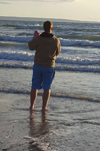 Mia and her dad on the beach