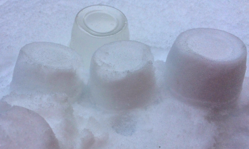 using cups to make snow castles