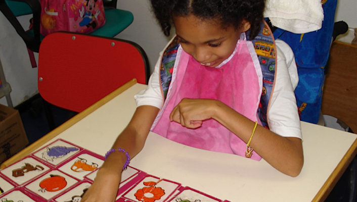 young girl playing with cards