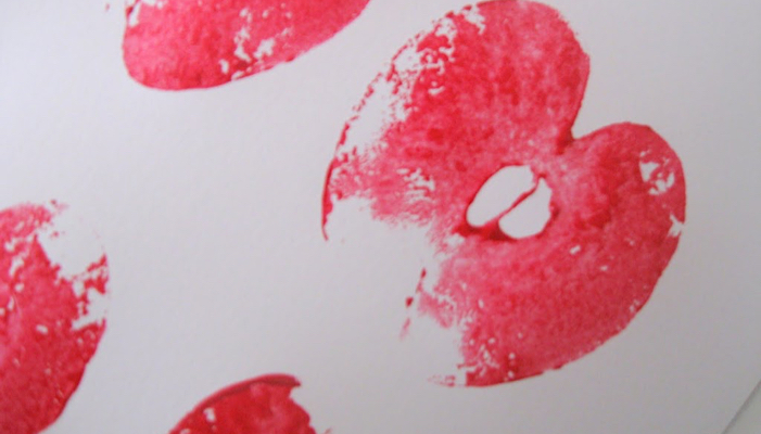 red apple prints on white paper