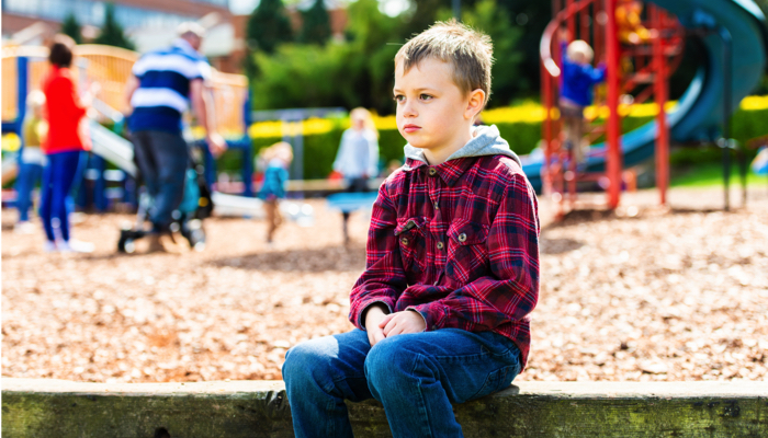 lonely boy on a playground