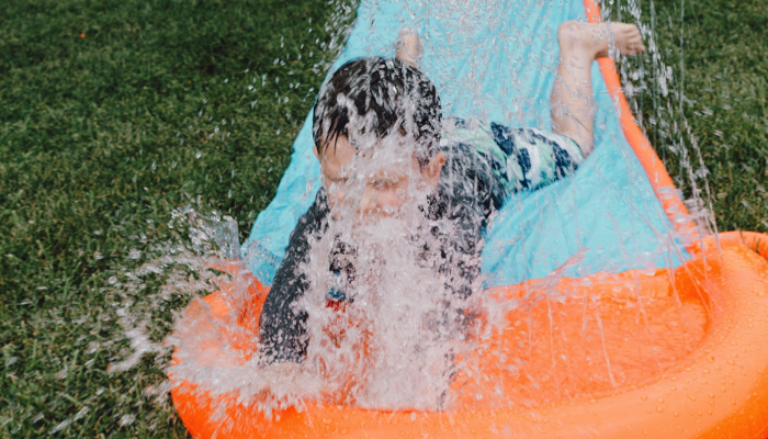 child on a water slide