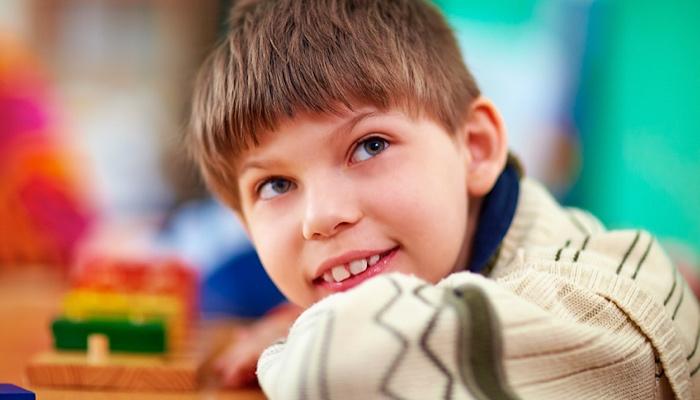 young boy smiling at school