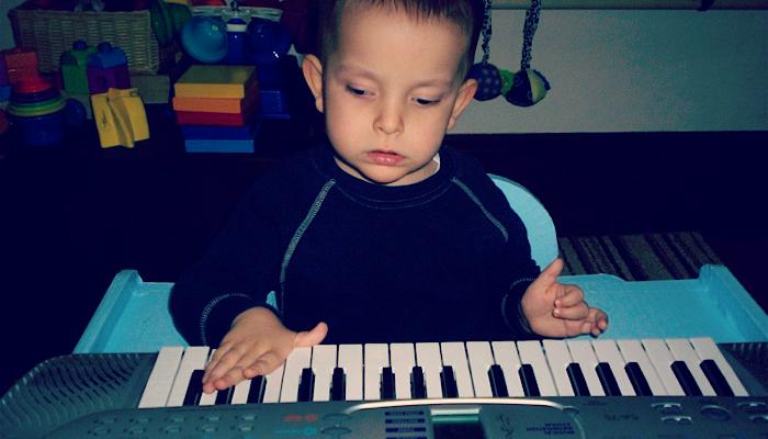 Ivan playing on his piano