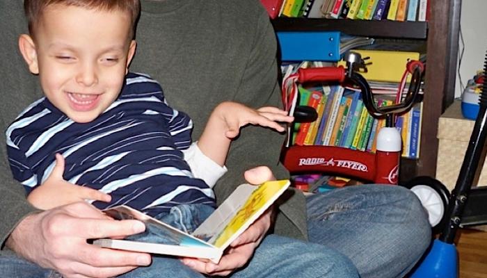 Ivan reading with his dad