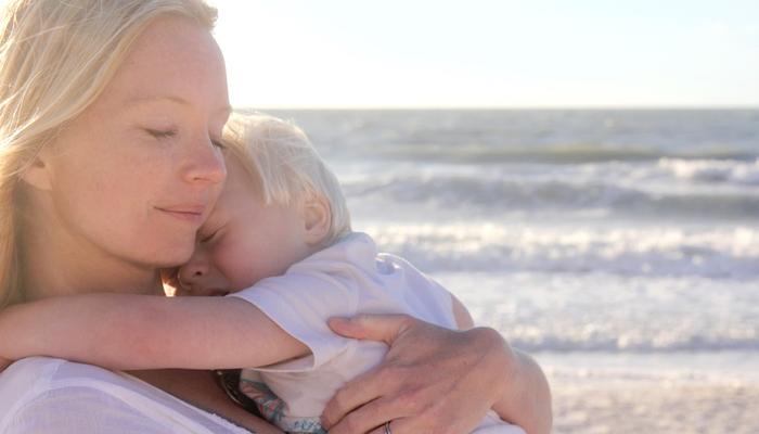 mom hugging baby