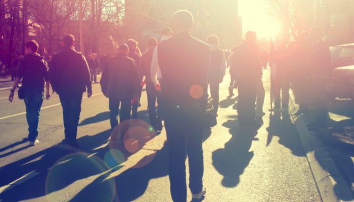 protestors walking down a street