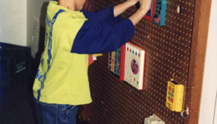 child at sensory board