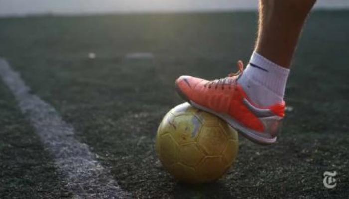A foot on a soccer ball