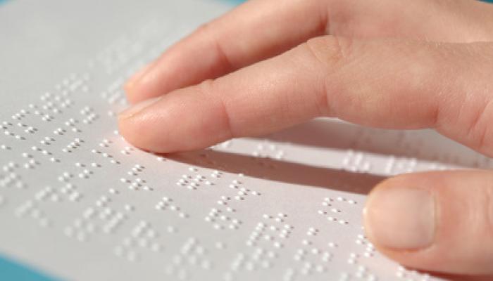 hand reading braille