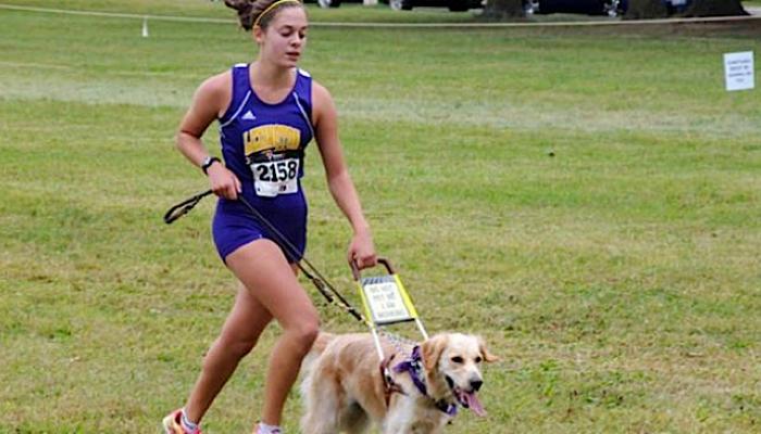 Sami Stoner running with her dog, Chloe