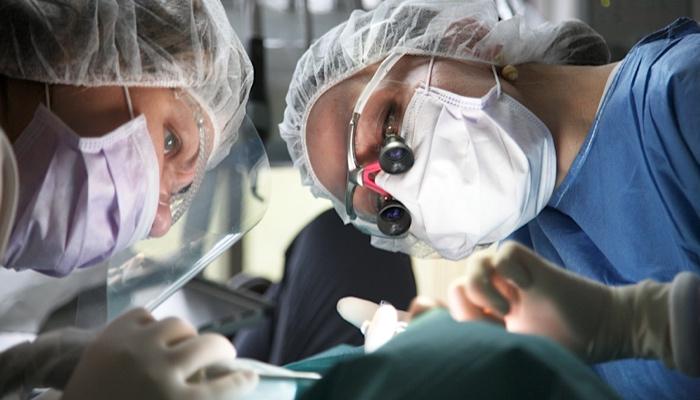 surgeons performing eye surgery