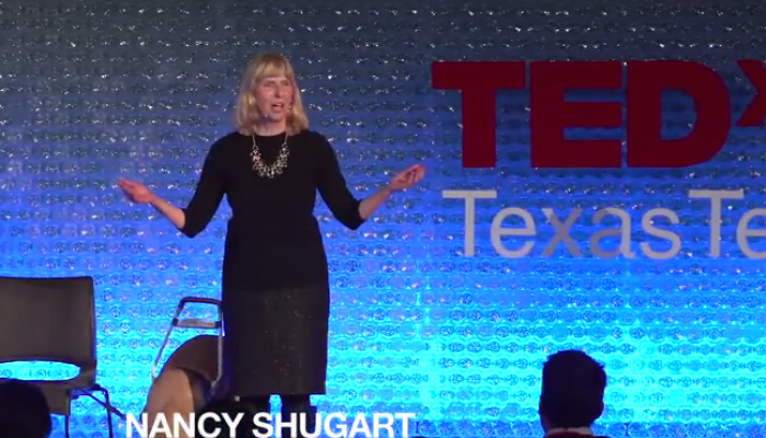 Nancy Shugart on stage for her TED talk.