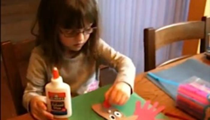 A girl making Hand & Foot Reindeer Ornament