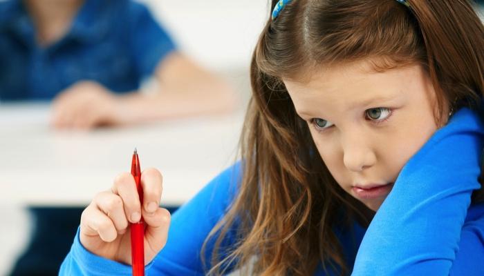 a girl in class looking frustrated