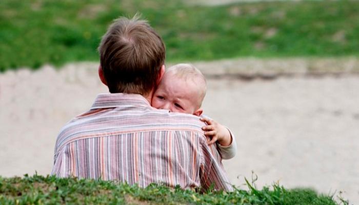 baby crying with his dad