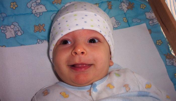 Ivan smiling as a baby
