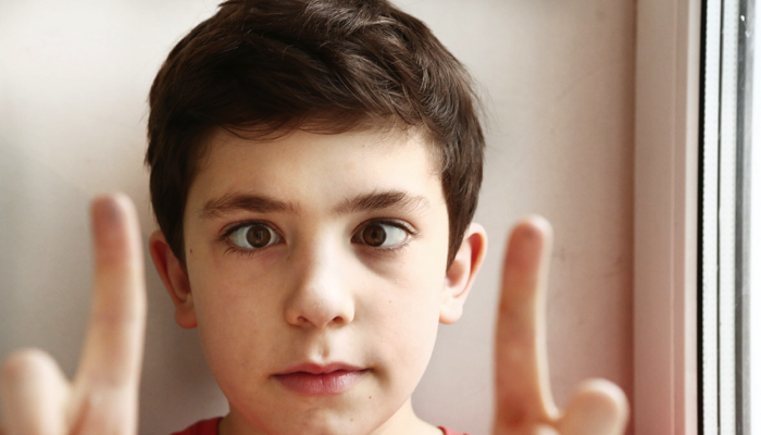 young boy with strabismus