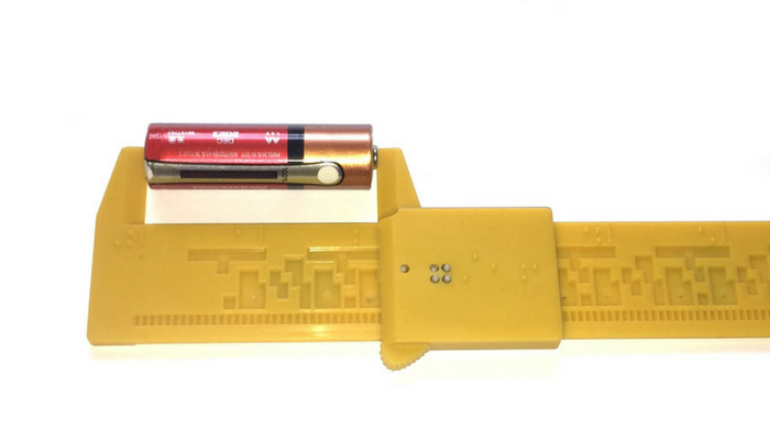 tactile caliper measuring a AA battery