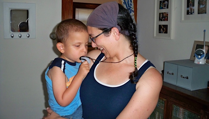 Ivan teething his mom's necklace